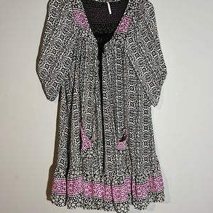 Free People MIDI Ruffle flowy dress size Mesiun. Black and cream print